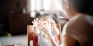 A mother feeding a baby
